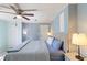 Cozy bedroom features a ceiling fan, comfortable bed, and soothing blue walls at 3384 Nebo Rd, Dallas, GA 30157