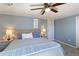 This bedroom includes a ceiling fan, comfortable bed, and nightstands at 3384 Nebo Rd, Dallas, GA 30157