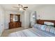 Comfortable bedroom showcasing a bed with patterned linens and a wooden dresser at 3384 Nebo Rd, Dallas, GA 30157