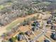 Enjoy this aerial shot of the homes located on the golf course. All are unique in design and landscaping features at 408 Hickory Fairway Ct, Woodstock, GA 30188