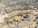 This aerial view features the lush landscaping and scenic views of the home's golf course community at 408 Hickory Fairway Ct, Woodstock, GA 30188