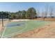 Basketball court and volleyball net with view of picnic table and landscaping at 408 Hickory Fairway Ct, Woodstock, GA 30188