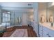 This primary bathroom boasts a soaking tub, walk in shower and dual sink vanity at 408 Hickory Fairway Ct, Woodstock, GA 30188