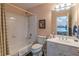 Bathroom featuring a shower-tub combo, a white single sink vanity and view to the bedroom at 408 Hickory Fairway Ct, Woodstock, GA 30188