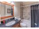Full bathroom with a granite countertop and tub-shower combo at 408 Hickory Fairway Ct, Woodstock, GA 30188
