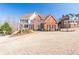 Stunning two-story brick home with manicured lawn and inviting front porch perfect for relaxing at 408 Hickory Fairway Ct, Woodstock, GA 30188