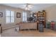 This home office has a large desk, two windows, and built in shelving units at 408 Hickory Fairway Ct, Woodstock, GA 30188