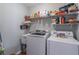 Laundry room featuring a washer and dryer and plenty of storage space at 408 Hickory Fairway Ct, Woodstock, GA 30188