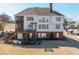 Expansive backyard with an outdoor patio, lush greenery, and multi-level deck at 408 Hickory Fairway Ct, Woodstock, GA 30188