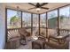 Relaxing screened porch featuring wicker furniture and views of the outdoors at 408 Hickory Fairway Ct, Woodstock, GA 30188