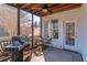 Relaxing screened porch with ceiling fan and comfortable seating, ideal for outdoor living at 408 Hickory Fairway Ct, Woodstock, GA 30188