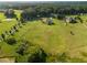 Expansive property featuring a beautiful home, surrounded by lush greenery and mature trees at 641 Freeman Brock Rd, Auburn, GA 30011