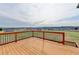 Wood deck overlooking a large backyard with lush green grass and blue skies at 641 Freeman Brock Rd, Auburn, GA 30011