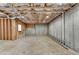 Spacious unfinished basement with exposed ceiling and concrete wall, ideal for future renovation at 641 Freeman Brock Rd, Auburn, GA 30011