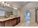 Bathroom featuring granite countertops, double sinks, and tiled shower with glass door at 641 Freeman Brock Rd, Auburn, GA 30011