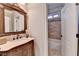 Bathroom featuring a vanity with granite countertop, and a shower with tiled walls at 641 Freeman Brock Rd, Auburn, GA 30011