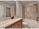 Bathroom featuring granite countertops, a walk-in closet, and a tiled shower and tub at 641 Freeman Brock Rd, Auburn, GA 30011