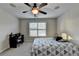 Bedroom featuring a ceiling fan, window, carpet, and a desk at 641 Freeman Brock Rd, Auburn, GA 30011