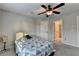 Carpeted bedroom with ceiling fan, and two closets at 641 Freeman Brock Rd, Auburn, GA 30011