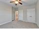 Bright bedroom with ceiling fan, soft carpet, and closet in a modern home at 641 Freeman Brock Rd, Auburn, GA 30011