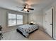 Cozy bedroom with carpet, ceiling fan, and a window providing natural light at 641 Freeman Brock Rd, Auburn, GA 30011