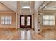 Elegant foyer with hardwood floors, decorative glass doors, and abundant natural light at 641 Freeman Brock Rd, Auburn, GA 30011