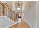 Foyer features hardwood floors, staircase, and natural light at 641 Freeman Brock Rd, Auburn, GA 30011