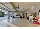 Spacious three car garage featuring a vehicle and storage racks at 641 Freeman Brock Rd, Auburn, GA 30011