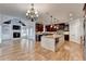 Open-concept kitchen has a large island with granite countertops and is open to the living area at 641 Freeman Brock Rd, Auburn, GA 30011