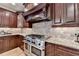 Gourmet kitchen features a stainless steel range and granite counters at 641 Freeman Brock Rd, Auburn, GA 30011