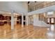 Spacious living area with staircase and views of the kitchen with wood floors at 641 Freeman Brock Rd, Auburn, GA 30011