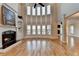 Spacious living room boasting hardwood floors, a fireplace, and expansive windows for abundant natural light at 641 Freeman Brock Rd, Auburn, GA 30011