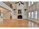 Spacious living room featuring hardwood floors, a fireplace and soaring two-story ceilings at 641 Freeman Brock Rd, Auburn, GA 30011