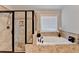 Luxurious main bathroom with a separate shower and soaking tub, perfect for relaxation at 641 Freeman Brock Rd, Auburn, GA 30011