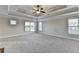 Spacious main bedroom with tray ceiling and natural light at 641 Freeman Brock Rd, Auburn, GA 30011