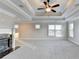 Spacious main bedroom with a fireplace and tray ceilings at 641 Freeman Brock Rd, Auburn, GA 30011