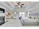 Main bedroom featuring tray ceilings, sitting area, and fireplace at 641 Freeman Brock Rd, Auburn, GA 30011