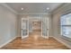 The room offers hardwood floors and a pair of glass paneled doors at 641 Freeman Brock Rd, Auburn, GA 30011