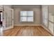 Room with natural light showcases gleaming hardwood floors and neutral wall colors at 641 Freeman Brock Rd, Auburn, GA 30011