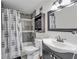 Cozy bathroom features a shower-tub combo, vanity, and a decorative mirror at 2479 Peachtree Ne Rd # 508, Atlanta, GA 30305