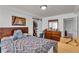 Carpeted bedroom features a barn-door closet, a dresser and an adjacent sitting area at 2479 Peachtree Ne Rd # 508, Atlanta, GA 30305
