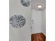 Apartment hallway features a white door, hardwood floors, and art at 2479 Peachtree Ne Rd # 508, Atlanta, GA 30305