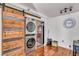 Convenient in-unit laundry with stacked washer and dryer, plus a sliding barn door at 2479 Peachtree Ne Rd # 508, Atlanta, GA 30305