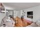 Open-concept living room with hardwood floors and electric fireplace at 2479 Peachtree Ne Rd # 508, Atlanta, GA 30305