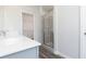 A bathroom with a glass-enclosed shower with tile surround and a double sink vanity at 2715 Stream Valley Lane Nw Nw Cir, Atlanta, GA 30318