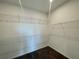 Walk-in closet with adjustable shelving, perfect for organizing clothes and accessories at 2715 Stream Valley Lane Nw Nw Cir, Atlanta, GA 30318