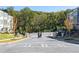 Gated community entrance surrounded by manicured landscaping and greenery at 2715 Stream Valley Lane Nw Nw Cir, Atlanta, GA 30318