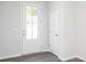 Bright entryway featuring a stylish front door and modern gray flooring at 2715 Stream Valley Lane Nw Nw Cir, Atlanta, GA 30318