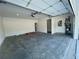 Spacious two-car garage with concrete flooring and an automatic door opener at 2715 Stream Valley Lane Nw Nw Cir, Atlanta, GA 30318