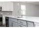 Modern kitchen featuring a central island, stainless steel dishwasher, and abundant counter space at 2715 Stream Valley Lane Nw Nw Cir, Atlanta, GA 30318
